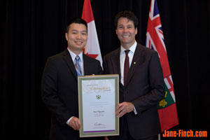 Paul Nguyen recieves the Newcomer Champion Award from Hon. Dr. Eric Hoskins, Ontario Minister of Citizenship and Immigration