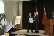 Paul Nguyen and Minister Eric Hoskins