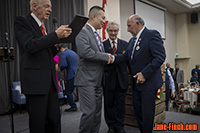 Paul Nguyen receiving award from MPP Aris Babikian